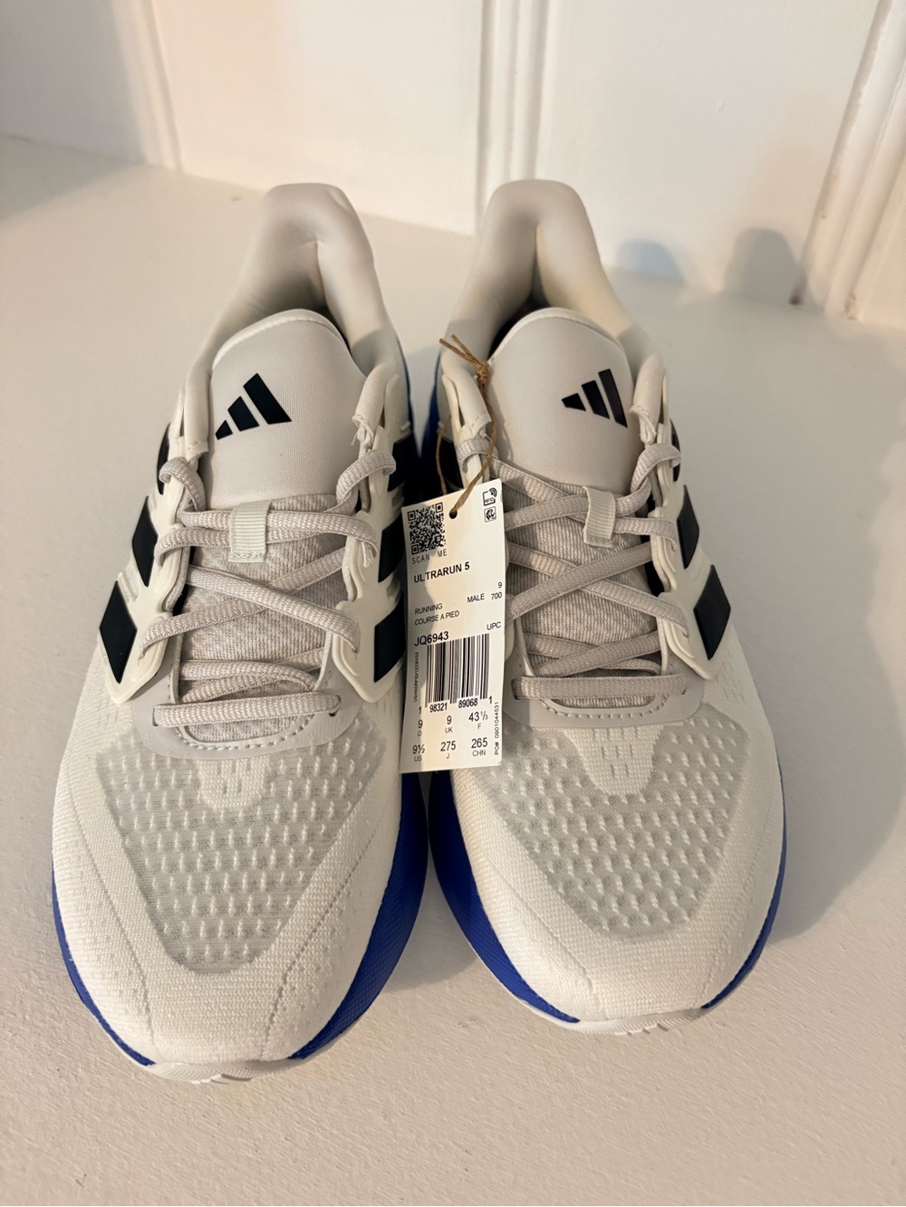 adidas White Sneakers with Black Stripes and Blue Soles